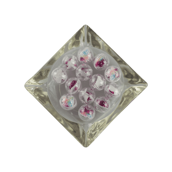 This is a collection of Gemball Machine prizes featuring a Ritual Co. sticker and 3mm, 4mm, 5mm and 6mm ruby terp pearls. Available at Ritual Colorado you can buy a spin for just $2.