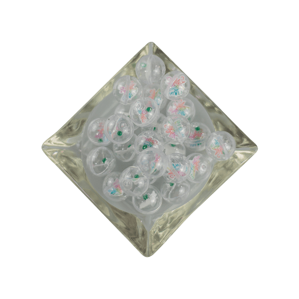 This is a collection of Gemball Machine prizes featuring a Ritual Co. sticker and 3mm green and clear terp pearls. Available at Ritual Colorado you can buy a spin for just $2.