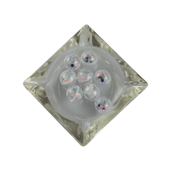 This is a collection of Gemball Machine prizes featuring a Ritual Co. sticker and 3mm ruby, green, clear and blue terp pearls. Available at Ritual Colorado you can buy a spin for just $2.