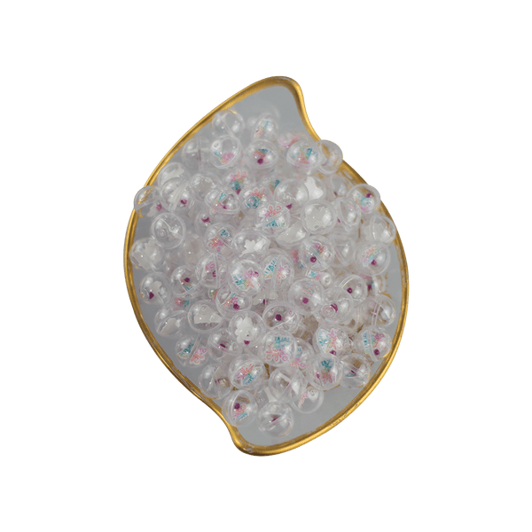 This is a collection of Gemball Machine prizes featuring a Ritual Co. sticker and 3mm ruby terp pearl. Available at Ritual Colorado you can buy a spin for just $2.