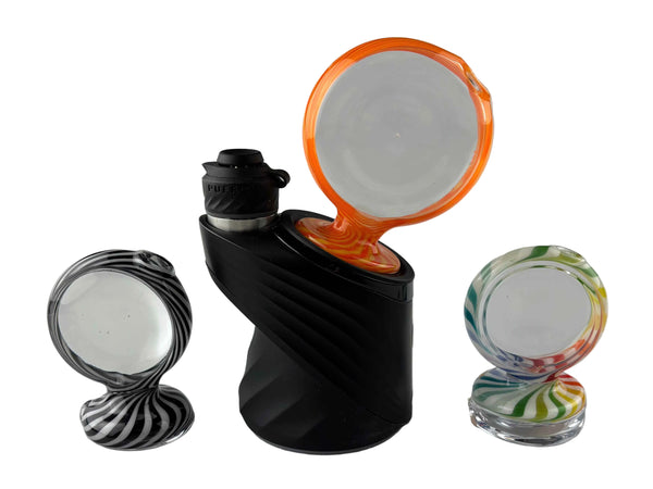 These are Disc Puffco Peak Dry Tops by Technicolor Tony available at Ritual Colorado. Featuring sleek clear discs with vibrant color outlines for a one-of-a-kind upgrade to your eRig.