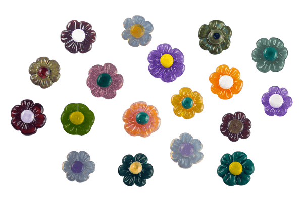 These are Glass Flower Choose-A-Charms by Technicolor Tony available at Ritual Colorado. Featuring customizable backing and handmade here in Denver, CO these unique glass charms are a vibrant way to show off some color.
