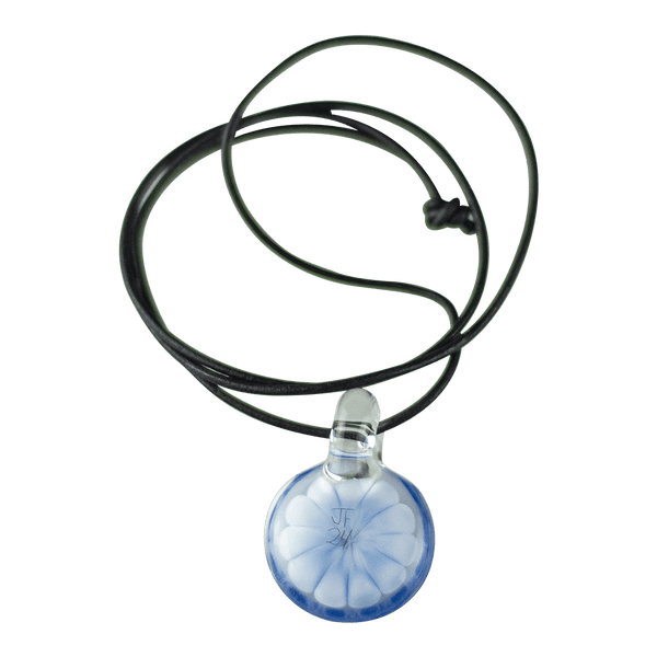 This is the Azure Burst Dot Stack Pendant from Faltermeier Glass available at Ritual Colorado. Exploding with tons of shades of blue and featuring an included leather cord this is an impressive piece of handmade glass art at a great price.