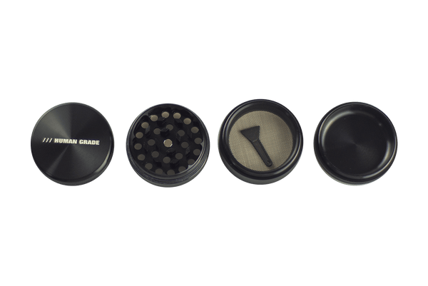 This is a 4-Piece, 2" Aluminum Grinder by Human Grade available at Ritual Colorado. Featuring a sleek finish and included scraper tool this is a great starter grinder and awesome value!