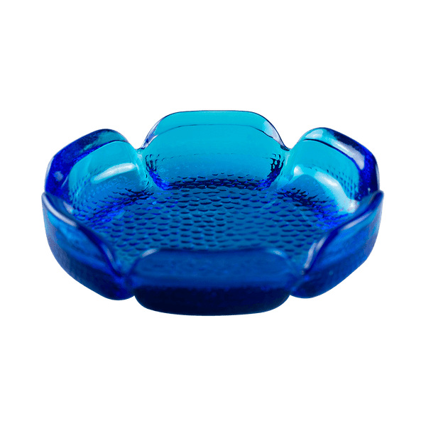 This is the Blenko Blue Lotus Glass Ashtray from Heady Vintage available at Ritual Colorado. The beautiful vintage ashtray features slits around the "petals" for convenient storage of your smoking and vaporizing tools.