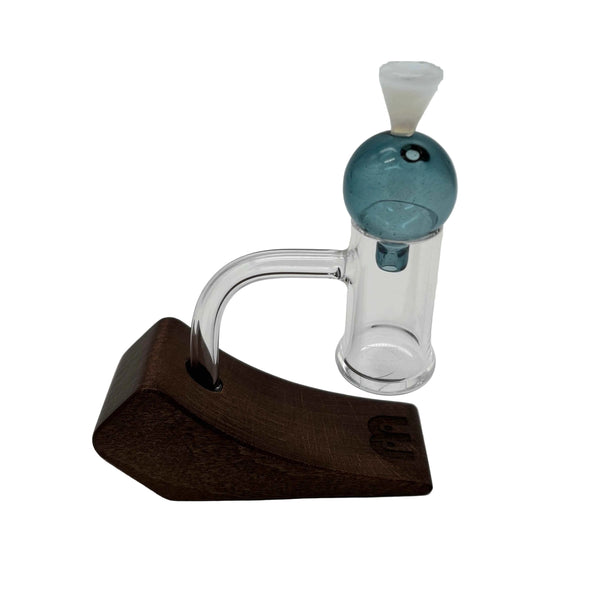 This is the Blue Heady Hollow Bubble Cap by Biting Glass available at Ritual Colorado. Featuring a solid handle accented by a hollow bubble for precise airflow in your banger.
