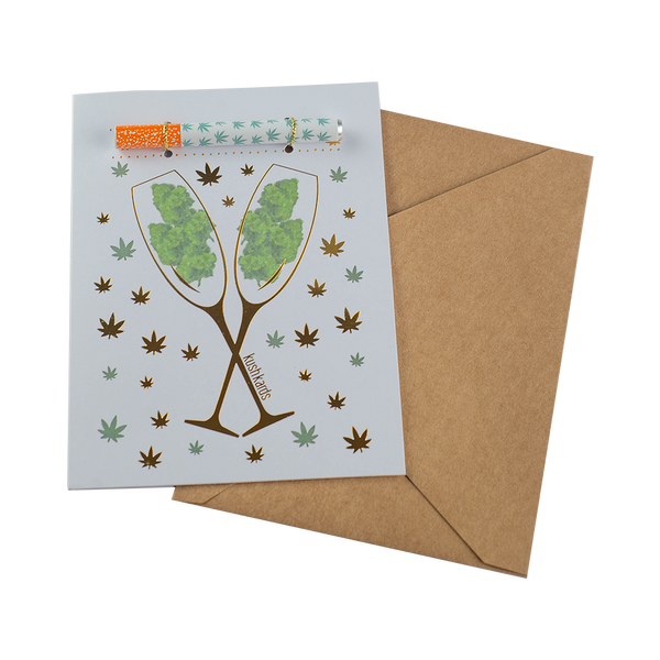 The "Congrats Champagne Buds" Greeting Card by KushKards with matching metal One Hitter available at Ritual Colorado. A fun cannabis-themed holiday card to help you celebrate the special moments.
