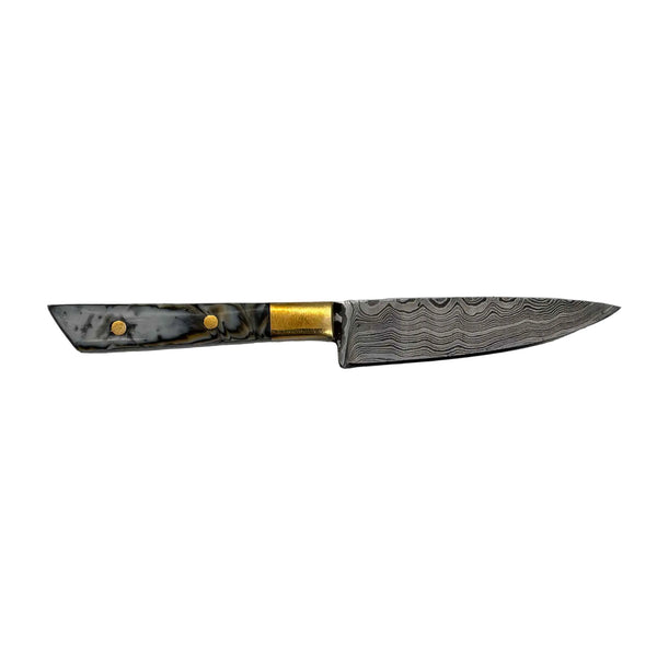 This is the Yellow Tiger Chef's Knife Dab Tool from Dabmascus available at Ritual Colorado. It features a two-pin handle and high-quality Damascus Steel blade for a truly unique and special dab tool made here in the U.S.
