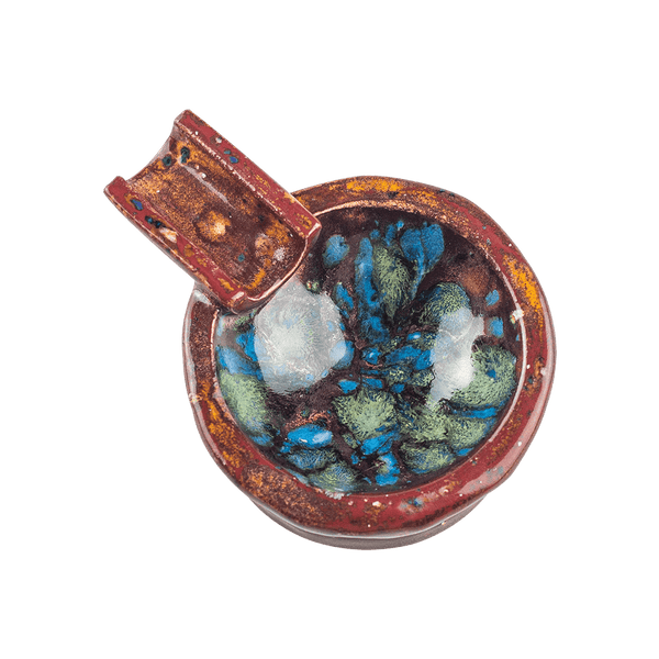 This is the Crown Jewels ceramic ash tray from Jaxel's Art available at Ritual Colorado. It features an extended arm perfect for holding your joint, dynavap or whip mouthpiece. Check out all the beautiful one-of-one ceramic products from Jaxel's Art and let us know if you're ever interested in a custom creation.