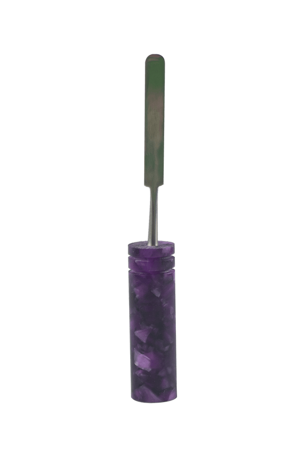 This is the Crushed Amethyst dab tool from Hash Handlez available at Ritual Colorado. A beautiful handmade dabber with a vibrant resin handle and included hard case.