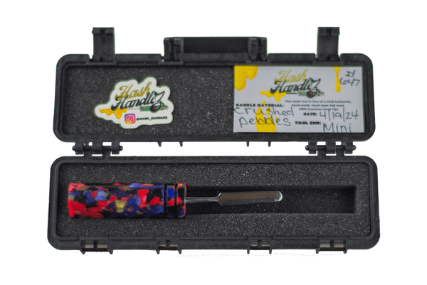 This is the Crushed Pebbles dab tool from Hash Handlez available at Ritual Colorado. These beautiful handmade tools feature beautiful resin handles and a protective carrying case.