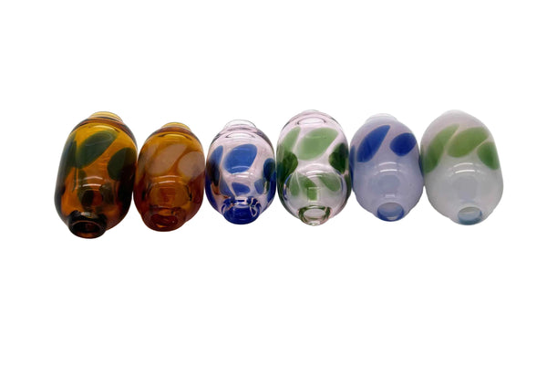 These are Dancing Dots Glass Macrame Beads by Biting Glass available at Ritual Colorado. Featuring color accent dots which swirl and dance around the bead for the perfect handmade upgrade to your craft project.
