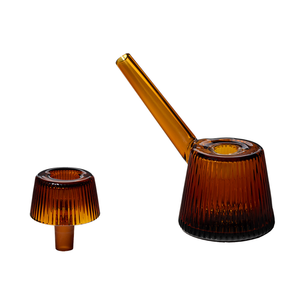 This is the Amber Deco Bubbler by NWTN Home available at Ritual Colorado. A beautiful, Art Deco inspired glass piece with an included 14mm slide for sleek sessions.