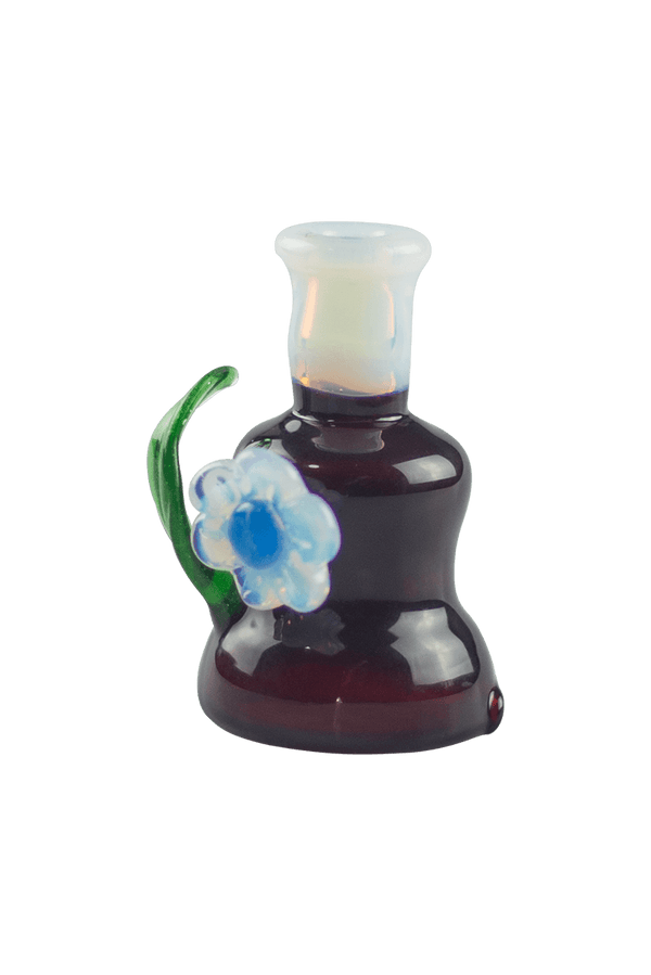 This is the Dark Phoenix Flower Top by Technicolor Tony available at Ritual Colorado. Featuring a ghost mouthpiece and flower and a green stardust leaf this is a fun upgrade for your Puffco Peak.