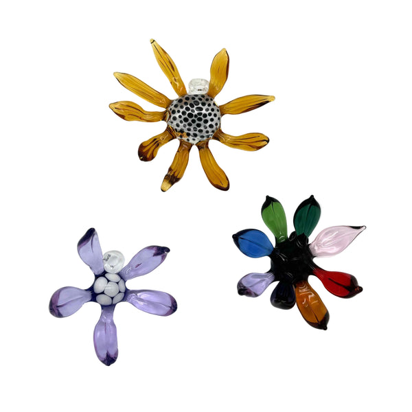 These are Glass Flower Wall Hangings by Biting Glass available at Ritual Colorado. Featuring vibrant glass colors these handcrafted decor pieces are the perfect way to spruce up a wall and come alive in front of a window or other light source.
