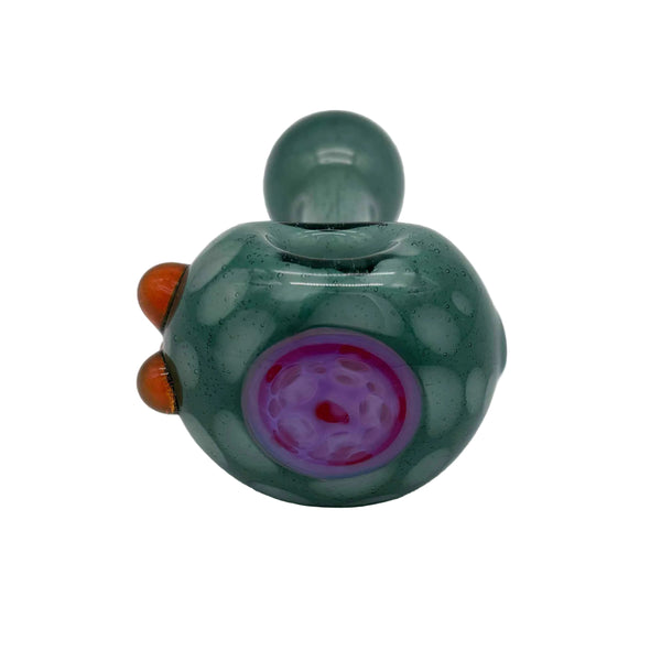 This is the Green Implosion Spoon Pipe by Technicolor Tony available at Ritual Colorado. A classic spoon pipe accented by a vibrant pink dot implosion on the end of the bowl and transparent orange accents.