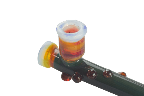 This is the Green Submarine Steamroller by Technicolor Tony available at Ritual Colorado. A sleek handmade glass pipe featuring vibrant colors and fun accents.
