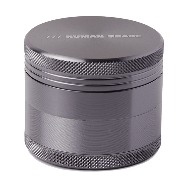 This is a Gunmetal 4-Piece, 2" Aluminum Grinder by Human Grade available at Ritual Colorado. Featuring a sleek finish and included scraper tool this is a great starter grinder and awesome value!