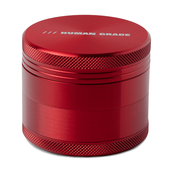 This is a Red 4-Piece, 2" Aluminum Grinder by Human Grade available at Ritual Colorado. Featuring a sleek finish and included scraper tool this is a great starter grinder and awesome value!