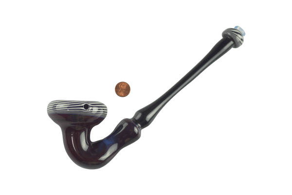 This is the King Sherlock Pipe by Technicolor Tony available at Ritual Colorado. A large hand pipe with clean lines and subtle color work for a one-of-one piece of glass art work.