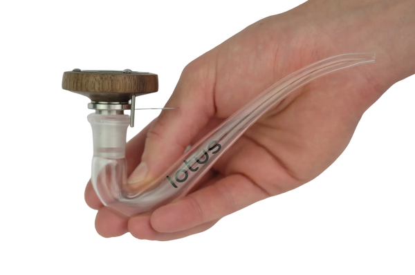 This is the Walnut Lotus Vaporizer Kit by INHALE available at Ritual Colorado. A portable torch-powered dry herb vape with included glass dry pipe and 14mm bowl that you can use with all your favorite glass bongs.