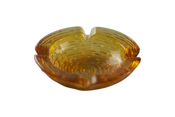 This is an Anchor Hocking Soreno Glass Ashtray in amber from Heady Vintage available at Ritual Colorado. It features a shallow well in the center with four indents around the edge for easy storage of your dry herb vaporization and dabbing tools.