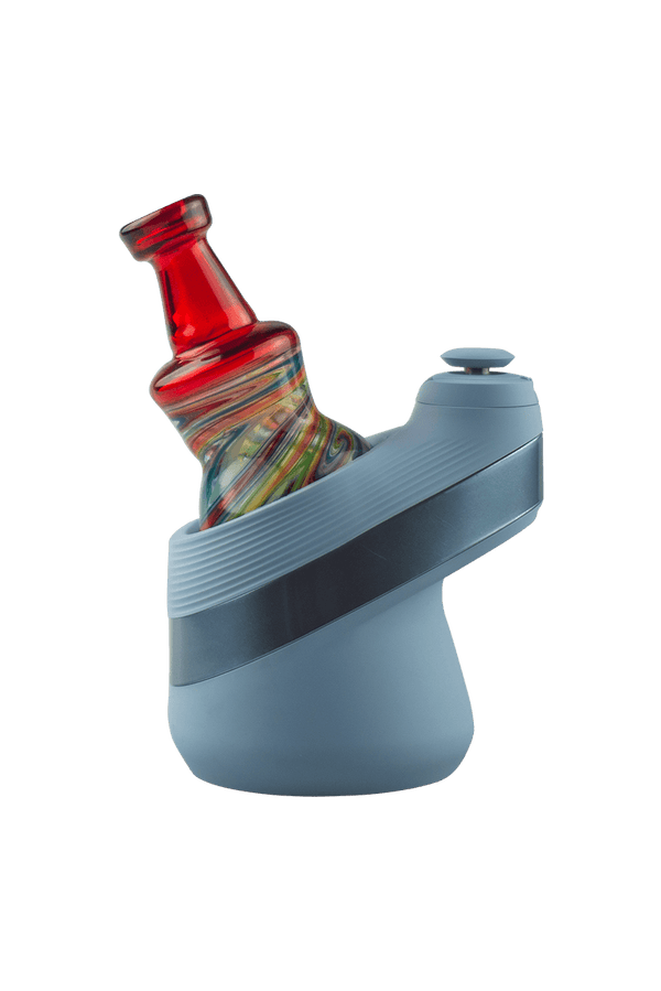 This is the Pomegranate Wig Wag Puffco Peak Dry Top from Technicolor Tonys available at Ritual Colorado. Featuring a multi-color swirling base accented by a bright colored mouthpiece.