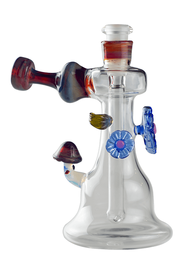 This is the Shroom Flower Bubbler from Technicolor Tonys available at Ritual Colorado. This beautiful heady glass piece features a stable base and clear glass which is accented by colorful flowers and a mushroom.