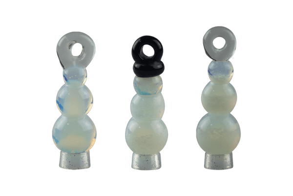 These are Snowman Ornaments by Biting Glass available at Ritual Colorado. These fun seasonal ornaments also work as pendants and feature vibrant glass colors.