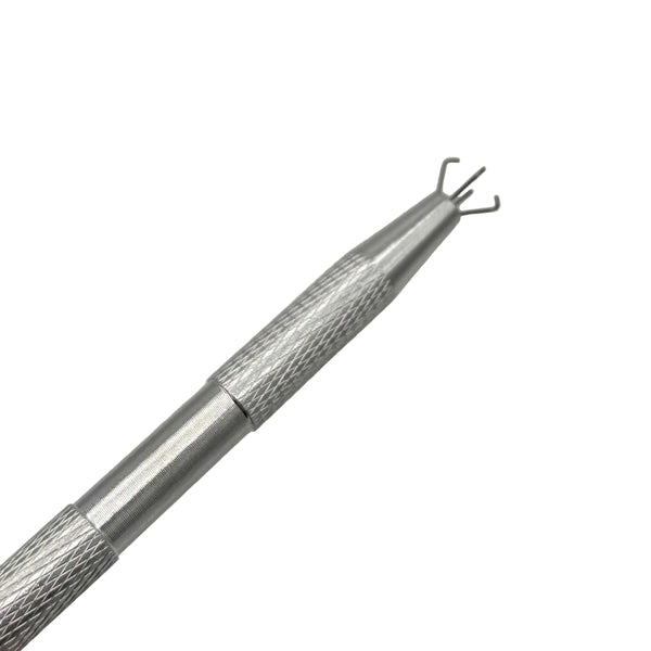 This is the Terp Pearl Claw by Ritual Co. available at Ritual Colorado. A sleek silver tool perfect for grabbing and moving terp balls. Simply press the end to extend four arms which securely grab your terp pearls.