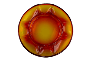 This is the Viking Dual Pipe & Ciagrette Ashtray in Persimmon from Heady Vintage available at Ritual Colorado. The many compartments and indents provide ample storage for your devices and accessories in this beautiful vintage glass ashtray.