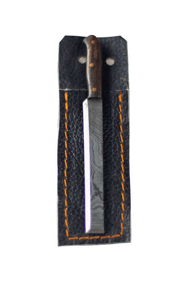 This is the sushi knife dab tool from Dabmascus available at Ritual Colorado. It features a three-pin handle and sushi-knife style blade from high-quality Damascus Steel.