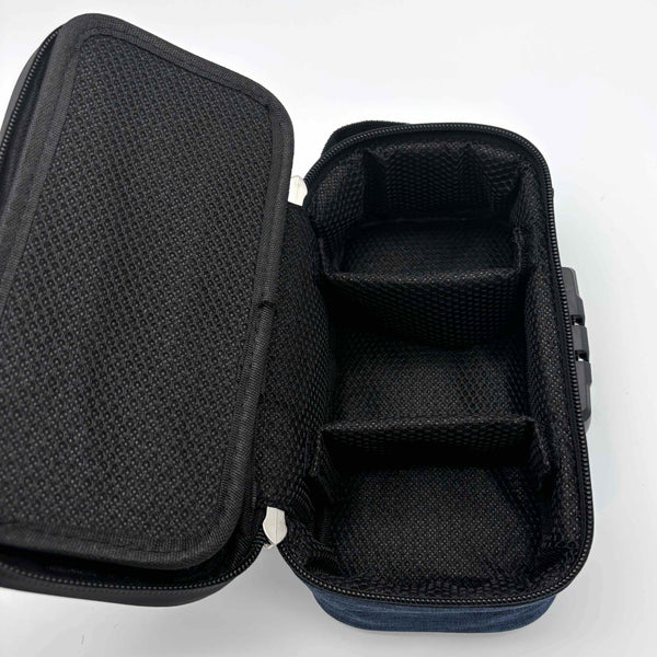 This is the Navy Locking Zipper Stash Bag by Ritual Co. available at Ritual Colorado. A sleek portable carry case that is weather resistant, has a programmable combination lock and features many customization options to fit all your gear.
