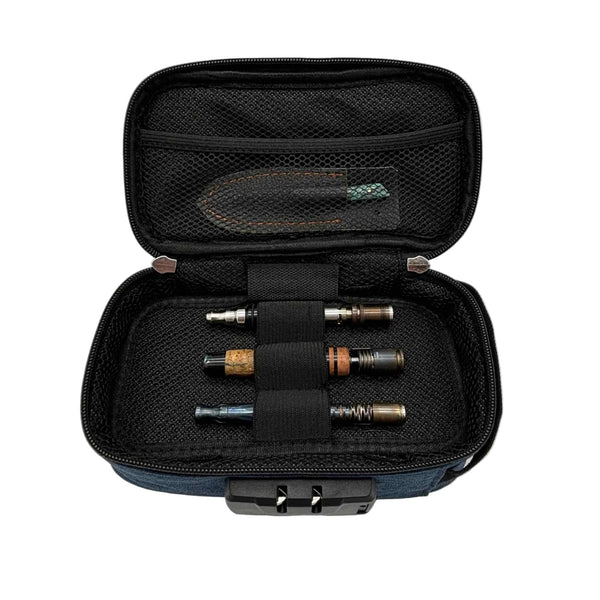 This is the Navy Locking Zipper Stash Bag by Ritual Co. available at Ritual Colorado. A sleek portable carry case that is weather resistant, has a programmable combination lock and features many customization options to fit all your gear.