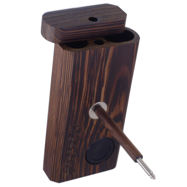 This is the DynaVap DynaStashER in Wenge Wood. Featuring a pop-out silicon concentrate holder, a magnet, and separate compartments for your device and herbal material. Available at Ritual.