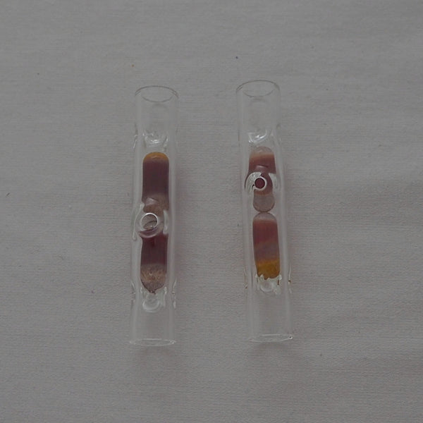 This is a 62mm terp pill stem from HighArtisan available at Ritual. It features two colored terp pills in a glass stem with a carb hole for maximum cooling and pill movement. Compatible with Dynavap tips this glass stem provides great cooling and nice looks.