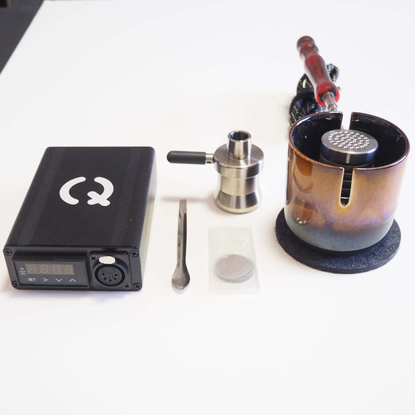 This is the Taroma Lite XL GO Kit from QaromaShop available at Ritual. Featuring a digital PID temperature controller, 30mm heater coil, StabWood coil handle, XL titanium adapter bowl, 3mm aroma ruby pearls, 25.4mm stainless steel screens, stainless steel scoop tool, Taroma Lite XL Housing, and a Suet Jade Porcelain Stand. A powerful and durable ball vape ready for daily use.