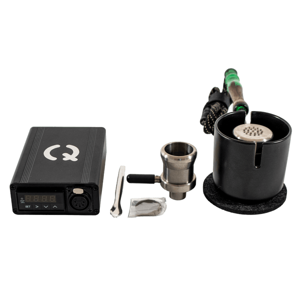 This is the Taroma XL GO Kit from QaromaShop available at Ritual. Featuring a digital PID temperature controller, 30mm heater coil, StabWood coil handle, titanium adapter XL bowl, 3mm aroma ruby pearls (x4), 25.4mm stainless steel screens, stainless steel scoop tool, Taroma XL Housing, and a Suet Jade Porcelain Stand. A powerful ball vape capable of standing up to the largest tolerances.