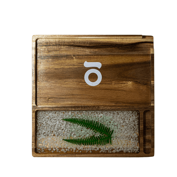 This is the Acacia Wood Tray from Ongrok available at Ritual. Each rolling tray is unique and features handmade details and a foodsafe finish.