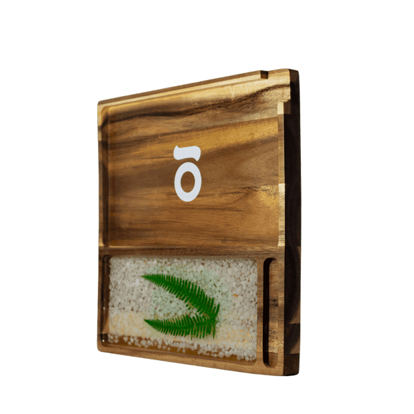 This is the Acacia Wood Tray from Ongrok available at Ritual. Each rolling tray is unique and features handmade details and a foodsafe finish.