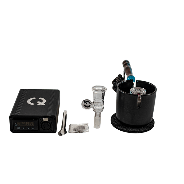 This is the Qaroma GO Kit from QaromaShop available at Ritual. Featuring a digital PID temperature controller, 20mm heater coil, StabWood coil handle, glass adapter bowl, 3mm aroma ruby pearls, 17mm stainless steel screens, stainless steel scoop tool, Qaroma Housing, and a Suet Jade Porcelain Stand. A flavorful ball vape that delivers impressive clouds.