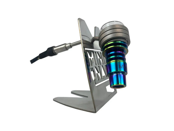 This is the MiniNail Heater Coil Stand pictured with a rainbow hybrid nail safely balancing. Available at Ritual.