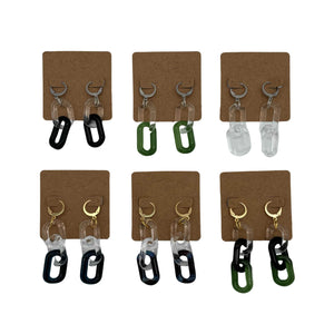 These are a collection of Glass Chain Earrings by Biting Glass available at Ritual Colorado. Featuring vibrant color accents and available in 2 and 3 link lengths these handmade jewelry pieces are the perfect accent accessory.