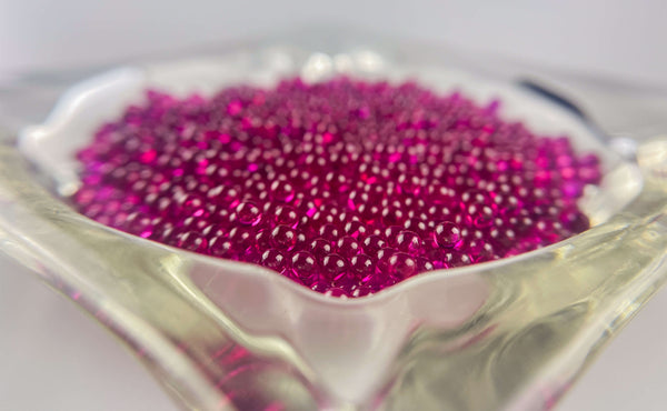 This is a vintage glass ashtray filled with tons of 3mm ruby terp pearls available at Ritual Colorado