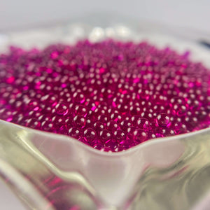 This is a vintage glass ashtray filled with tons of 3mm ruby terp pearls available at Ritual Colorado