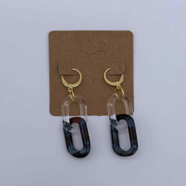 These are 2 link Amber Purple Glass Chain Earrings by Biting Glass available at Ritual Colorado. Featuring vibrant color accents these handmade jewelry pieces are the perfect accent accessory.