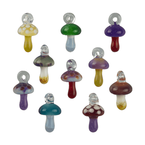 These are Mini Mushroom Pendants by Biting Glass available at Ritual Colorado. Featuring a built-in glass loop as well as vibrant colored mushrooms these are fun little jewelry and decor pieces.