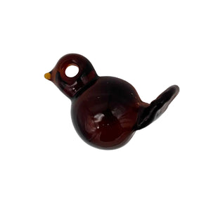This is the Amber Chubby Glass Bird Ornament by Biting Glass available at Ritual Colorado. These fun handmade glass ornaments feature vibrant colors and fun sitting bird motifs.
