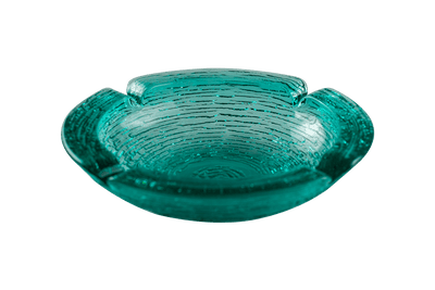 This is an Anchor Hocking Soreno Glass Ashtray in aqua from Heady Vintage available at Ritual Colorado. It features a deep well in the center with four indents around the edge for easy storage of your dry herb vaporization and dabbing tools. 