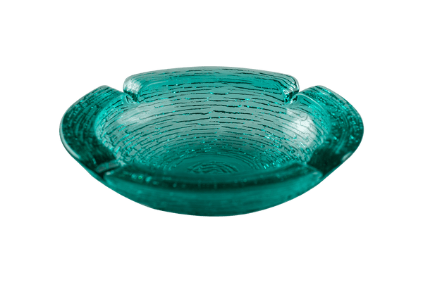 This is an Anchor Hocking Soreno Glass Ashtray in aqua from Heady Vintage available at Ritual Colorado. It features a deep well in the center with four indents around the edge for easy storage of your dry herb vaporization and dabbing tools. 